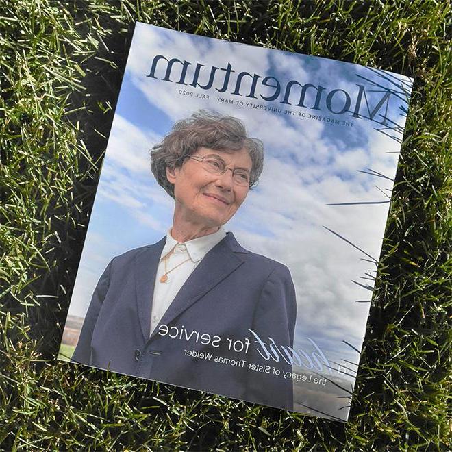 A momentum magazine staged on grass